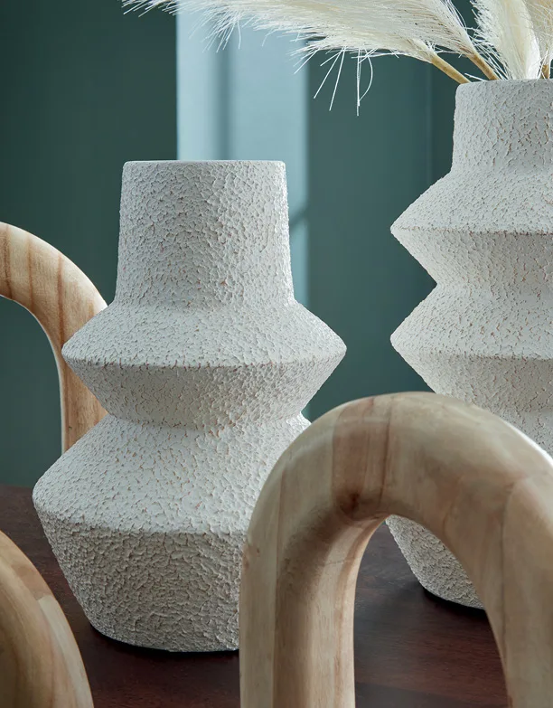 Close-up of textured white ceramic vases