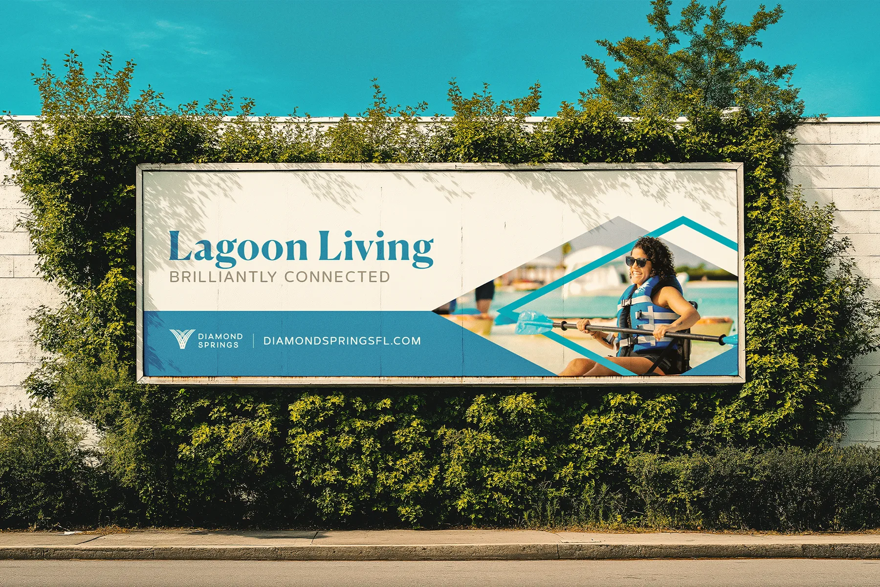 Diamond Springs Lagoon Living billboard in context on a roadside location